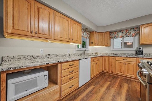 4301B W Sanborn Rd, Lake City, MI 49651 - kitchen with white appliances, light stone countertops, and dark wood-style flooring