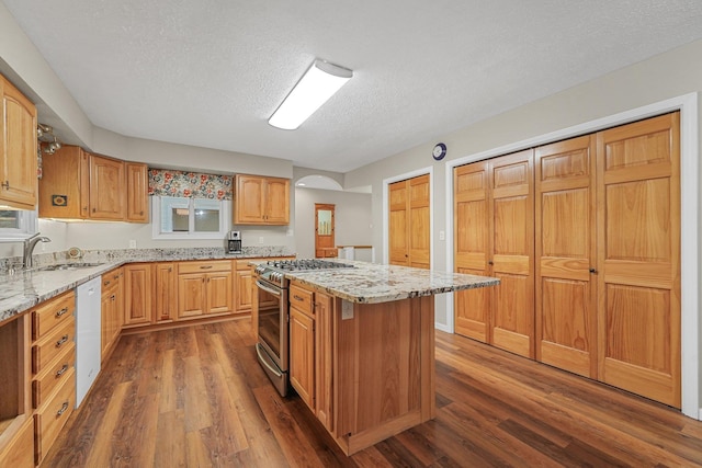 4301B W Sanborn Rd, Lake City, MI 49651 - kitchen featuring gas stove, dishwasher, dark wood-style floors, a textured ceiling, and light stone counters