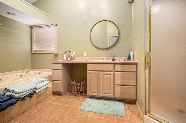 27418 Orchard Dr, Sturgis, MI 49091 - bathroom with vanity, tile patterned floors, a garden tub, and a shower stall