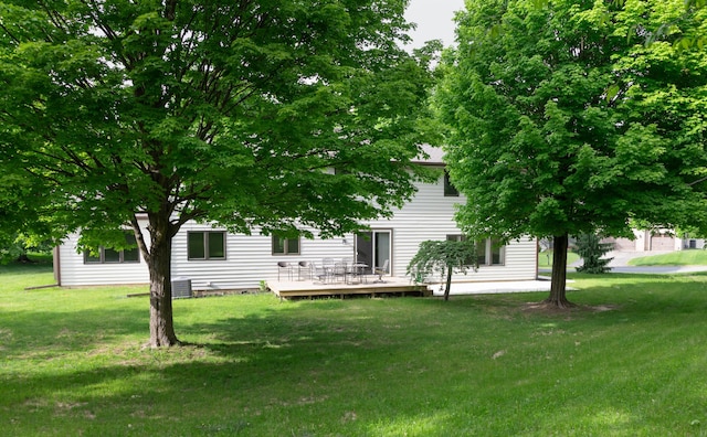 5825 Saddle Club Dr, Kalamazoo, MI 49009 - view of grassy yard with a deck
