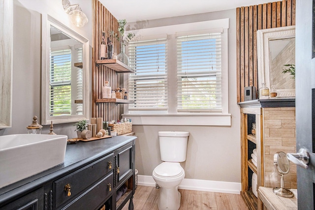 832 Clancy Ave NE, Grand Rapids, MI 49503 - bathroom featuring vanity and wood finished floors