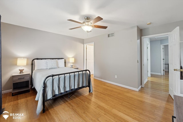 11419 Autumn Breeze Trl, Clio, MI 48420 - bedroom with light wood-style flooring and ceiling fan