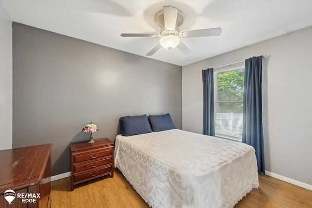 11419 Autumn Breeze Trl, Clio, MI 48420 - bedroom featuring light wood-style flooring and ceiling fan