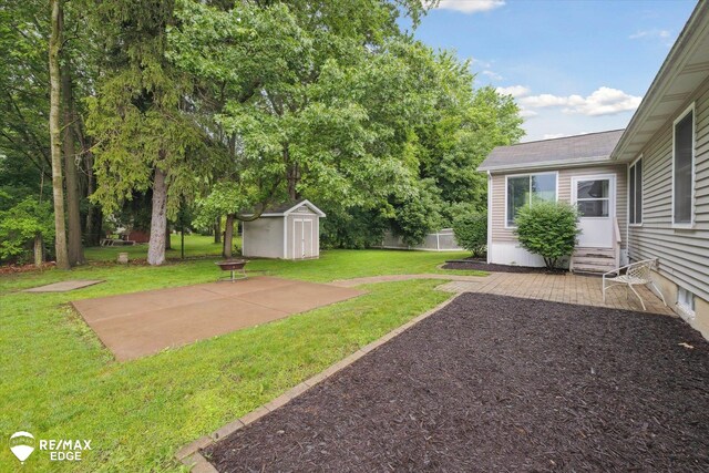 11419 Autumn Breeze Trl, Clio, MI 48420 - view of yard featuring entry steps, a patio, and a storage shed
