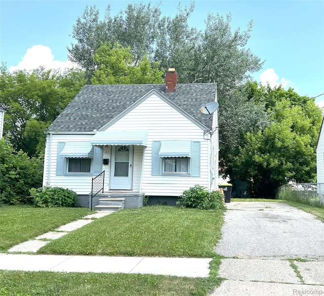 182 Crystal Lake Dr, Pontiac, MI 48341 - bungalow-style home with a shingled roof, a front lawn, a chimney, and entry steps