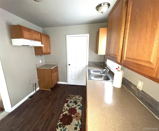 182 Crystal Lake Dr, Pontiac, MI 48341 - kitchen with under cabinet range hood and brown cabinetry