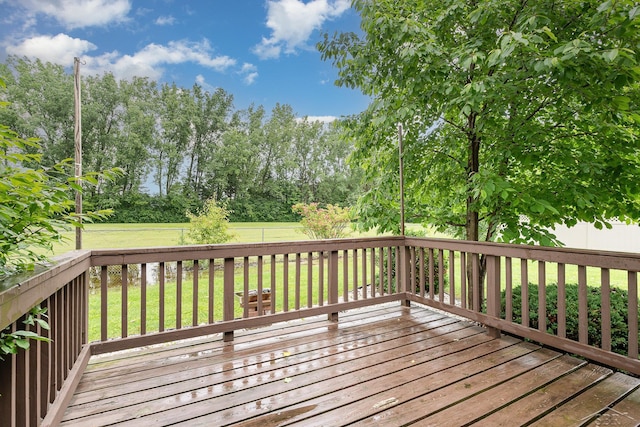 4918 Frontier Ln, Saginaw, MI 48603 - deck featuring a fenced backyard and view of wooded area