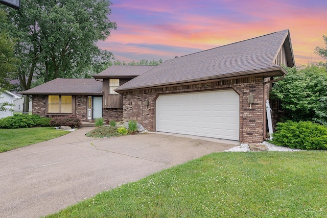 4918 Frontier Ln, Saginaw, MI 48603 - view of front facade with brick siding, driveway, a front yard, a shingled roof, and a garage
