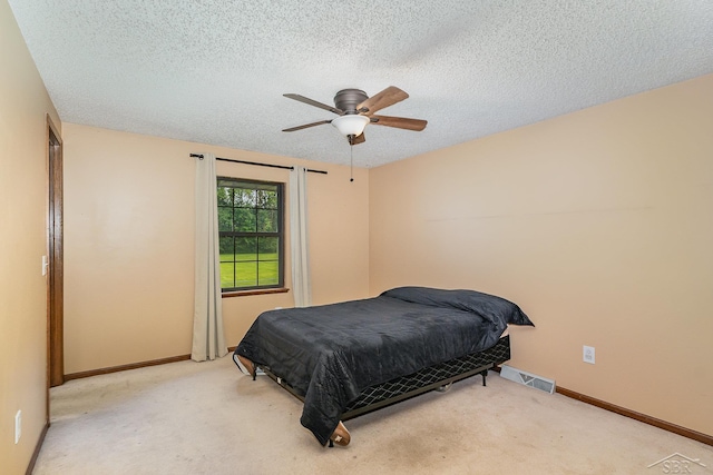 4918 Frontier Ln, Saginaw, MI 48603 - carpeted bedroom with a textured ceiling and a ceiling fan