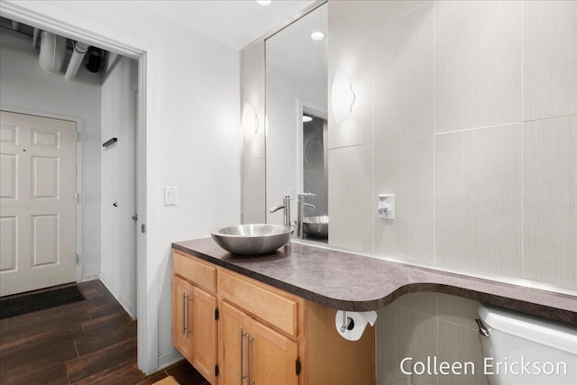 600 Monroe Ave NW Unit 409, Grand Rapids, MI 49503 - bathroom featuring vanity and wood finished floors