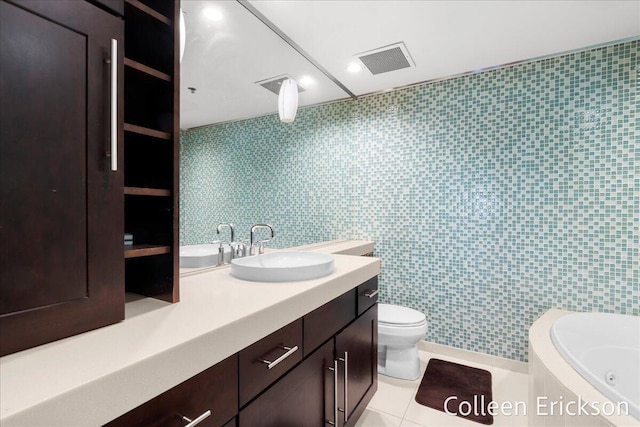 600 Monroe Ave NW Unit 409, Grand Rapids, MI 49503 - full bathroom with a tub with jets, vanity, and tile patterned floors