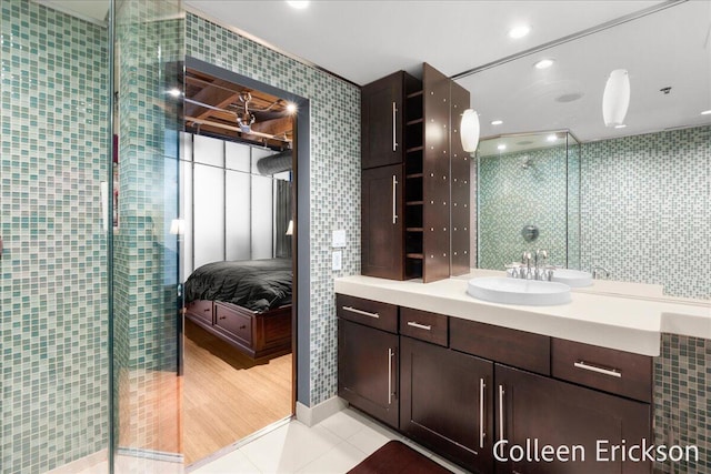 600 Monroe Ave NW Unit 409, Grand Rapids, MI 49503 - full bath featuring vanity, ensuite bathroom, a tile shower, tile patterned flooring, and recessed lighting