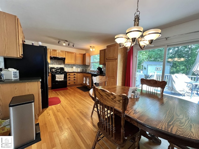 1306 Rosalie Dr, Fenton, MI 48430 - dining room featuring light wood-type flooring and a chandelier