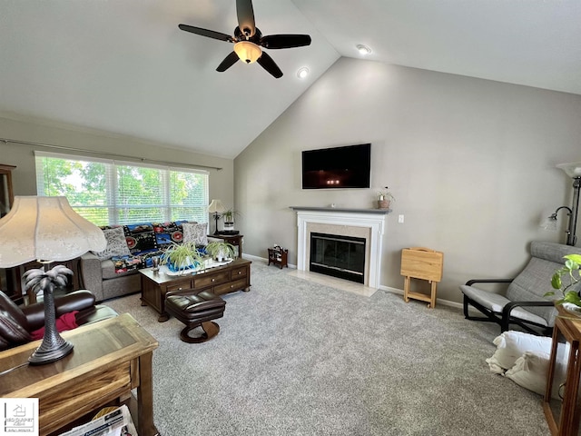 1306 Rosalie Dr, Fenton, MI 48430 - living area featuring ceiling fan, a fireplace with flush hearth, carpet flooring, and high vaulted ceiling