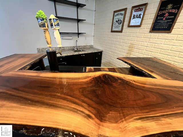 1306 Rosalie Dr, Fenton, MI 48430 - indoor wet bar featuring brick wall