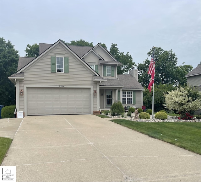 1306 Rosalie Dr, Fenton, MI 48430 - traditional-style house with concrete driveway, an attached garage, a chimney, a front lawn, and a shingled roof