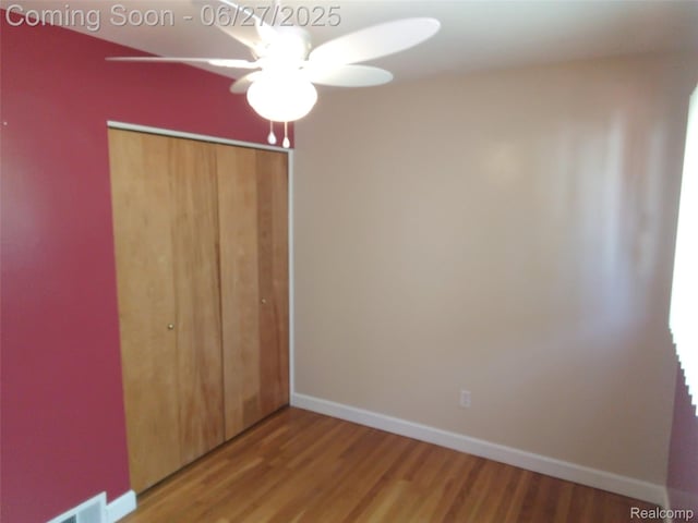 8283 Christine St, Warren, MI 48093 - unfurnished bedroom with a closet, wood finished floors, and ceiling fan