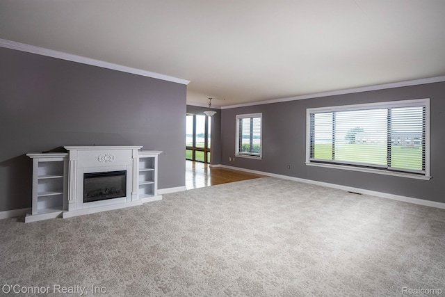 1660 River Rd Unit 7, Marysville, MI 48040 - unfurnished living room with carpet floors, crown molding, and a glass covered fireplace