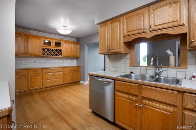 1660 River Rd Unit 7, Marysville, MI 48040 - kitchen with dishwasher, decorative backsplash, light countertops, and light wood-style flooring