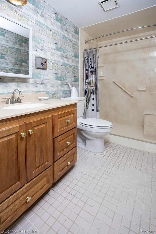1660 River Rd Unit 7, Marysville, MI 48040 - bathroom with tile patterned flooring, a tile shower, and vanity