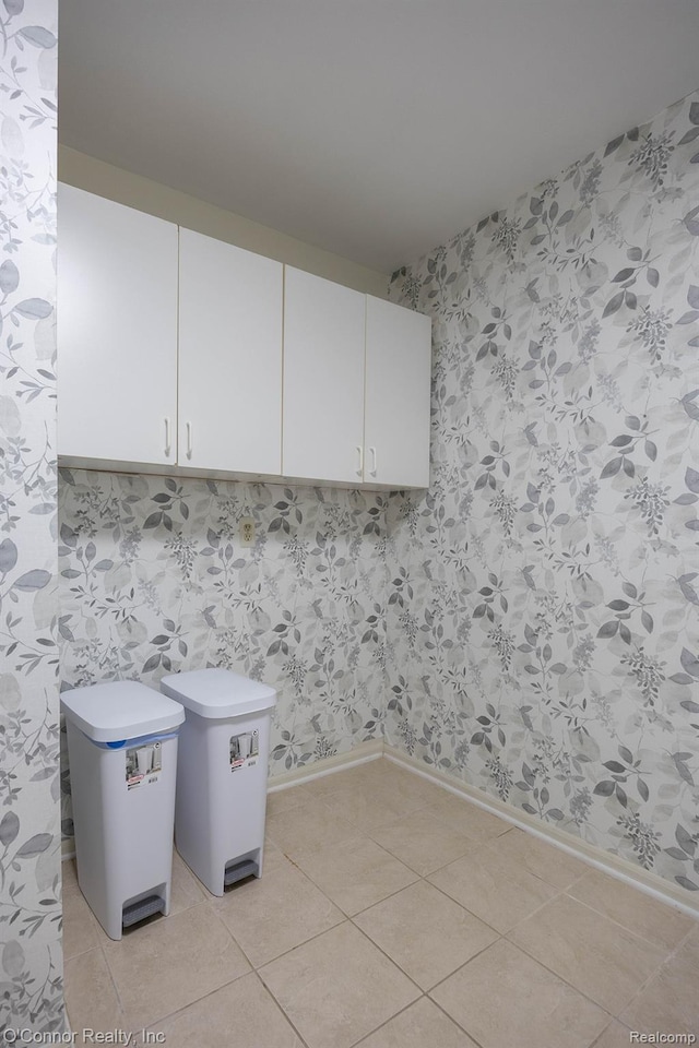 1660 River Rd Unit 7, Marysville, MI 48040 - laundry area with baseboards and light tile patterned floors