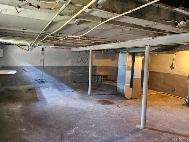 1102 W Atherton Rd W, Flint, MI 48507 - unfinished below grade area featuring heating unit