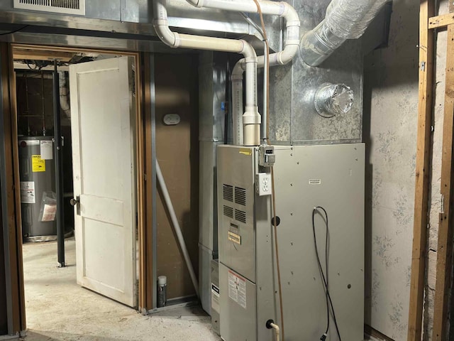 57993 Oak Park Rd, Three Rivers, MI 49093 - utility room featuring water heater and heating unit