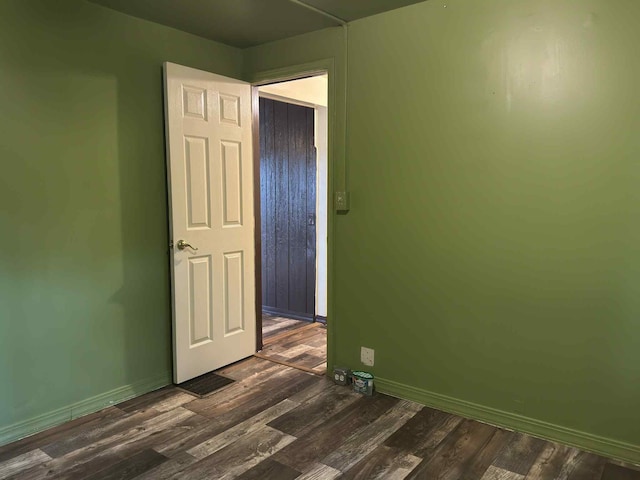 57993 Oak Park Rd, Three Rivers, MI 49093 - spare room with dark wood-style flooring and baseboards