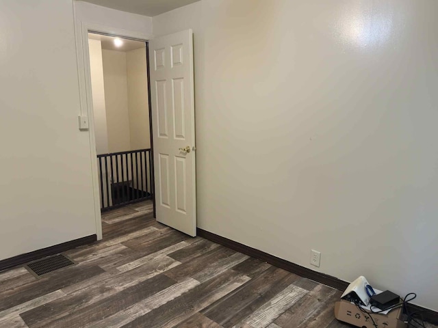 57993 Oak Park Rd, Three Rivers, MI 49093 - empty room with dark wood-style flooring and baseboards