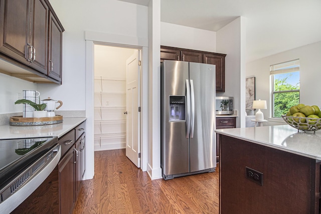 6378 N Trailwoods Dr, Ann Arbor, MI 48103 - kitchen featuring appliances with stainless steel finishes, dark wood-type flooring, dark brown cabinetry, and light countertops