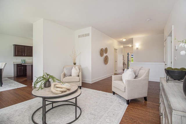 6378 N Trailwoods Dr, Ann Arbor, MI 48103 - living room with dark wood-style flooring and baseboards