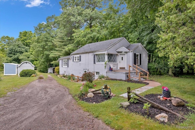 4155 Mill Lake Rd, Lake Orion, MI 48360 - view of front of house with a front yard and a storage unit