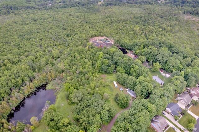 4155 Mill Lake Rd, Lake Orion, MI 48360 - aerial overview of property's location featuring a heavily wooded area and a large body of water