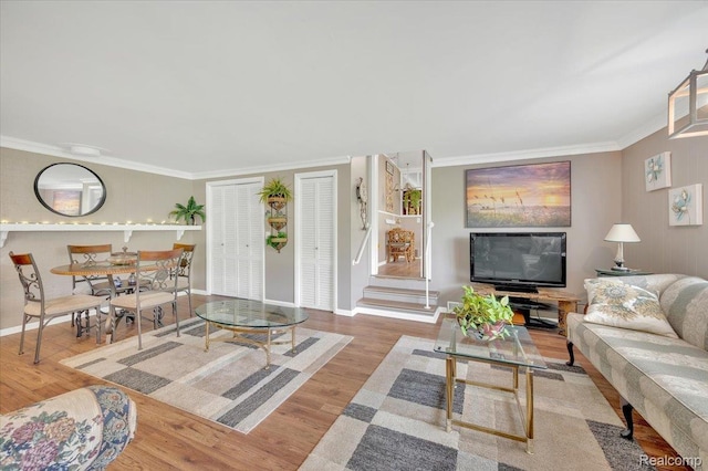 4155 Mill Lake Rd, Lake Orion, MI 48360 - living area with crown molding, wood finished floors, and stairs