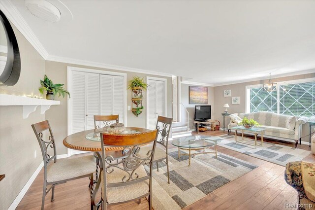 4155 Mill Lake Rd, Lake Orion, MI 48360 - dining room featuring wood finished floors and crown molding
