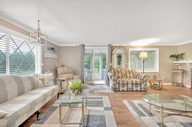 4155 Mill Lake Rd, Lake Orion, MI 48360 - living area with ornamental molding, wood finished floors, and a chandelier