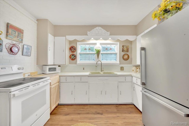 4155 Mill Lake Rd, Lake Orion, MI 48360 - kitchen featuring white appliances, light countertops, white cabinetry, and light wood finished floors