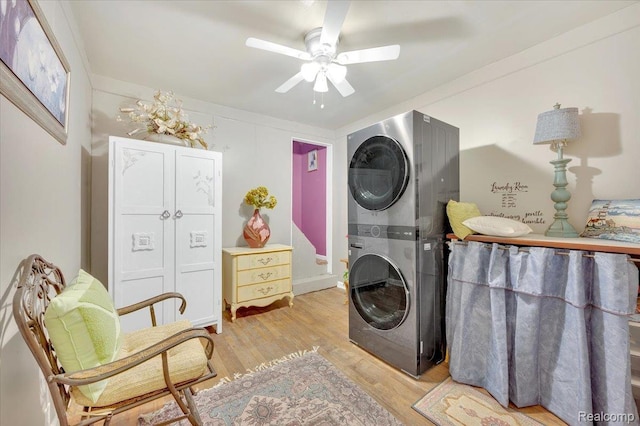 4155 Mill Lake Rd, Lake Orion, MI 48360 - laundry area featuring stacked washing machine and dryer, ceiling fan, and light wood-type flooring