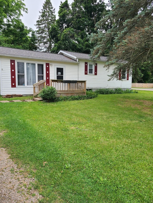 901 Helena Ave, Jackson, MI 49203 - view of front of property with a wooden deck and a front lawn
