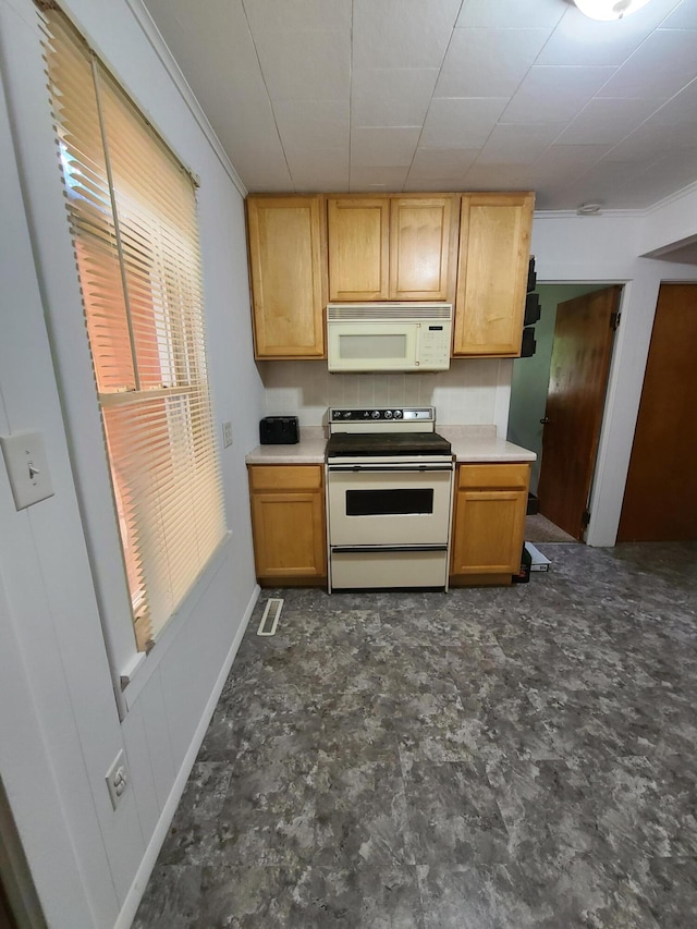 901 Helena Ave, Jackson, MI 49203 - kitchen featuring white appliances, ornamental molding, and light countertops