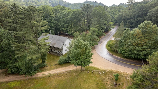 8867 W Garfield Rd, Shelby, MI 49455 - aerial view of property and surrounding area with a heavily wooded area