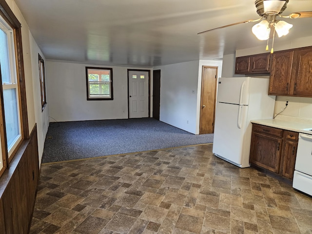 8867 W Garfield Rd, Shelby, MI 49455 - kitchen featuring freestanding refrigerator, range, light countertops, open floor plan, and ceiling fan