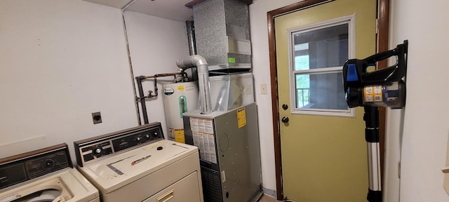 8867 W Garfield Rd, Shelby, MI 49455 - laundry area featuring washing machine and clothes dryer and water heater