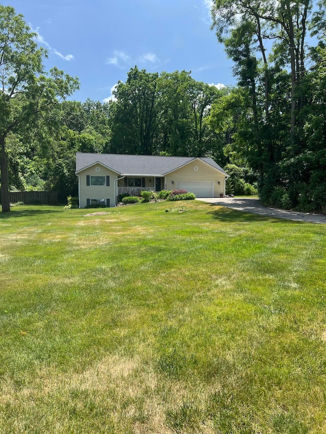 5437 Grand River Dr NE, Grand Rapids, MI 49525 - ranch-style house with an attached garage and driveway