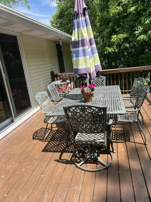 5437 Grand River Dr NE, Grand Rapids, MI 49525 - wooden terrace with outdoor dining area