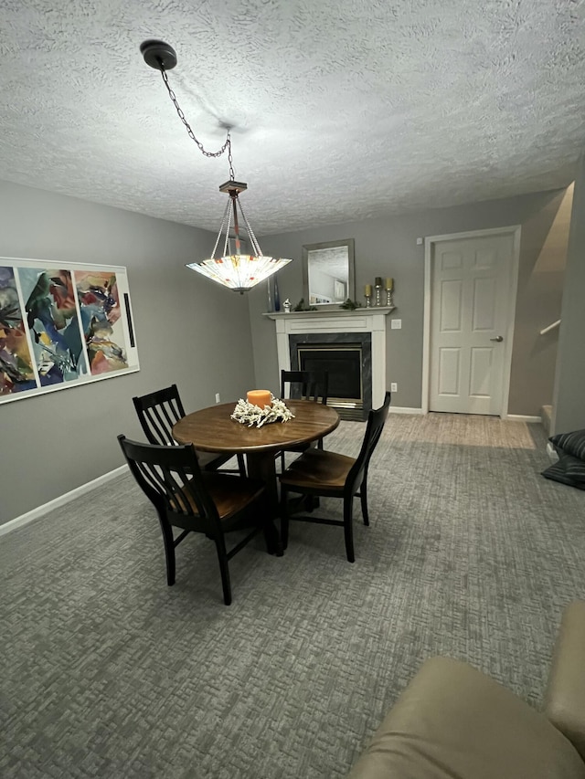 5437 Grand River Dr NE, Grand Rapids, MI 49525 - dining space with a fireplace, a textured ceiling, and carpet flooring
