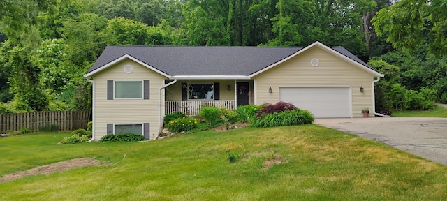 5437 Grand River Dr NE, Grand Rapids, MI 49525 - ranch-style home featuring covered porch, concrete driveway, an attached garage, and roof with shingles