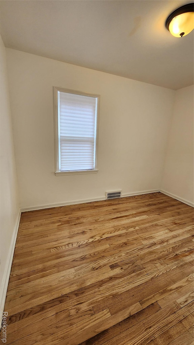 10947 Roxbury St, Detroit, MI 48224 - spare room featuring wood finished floors