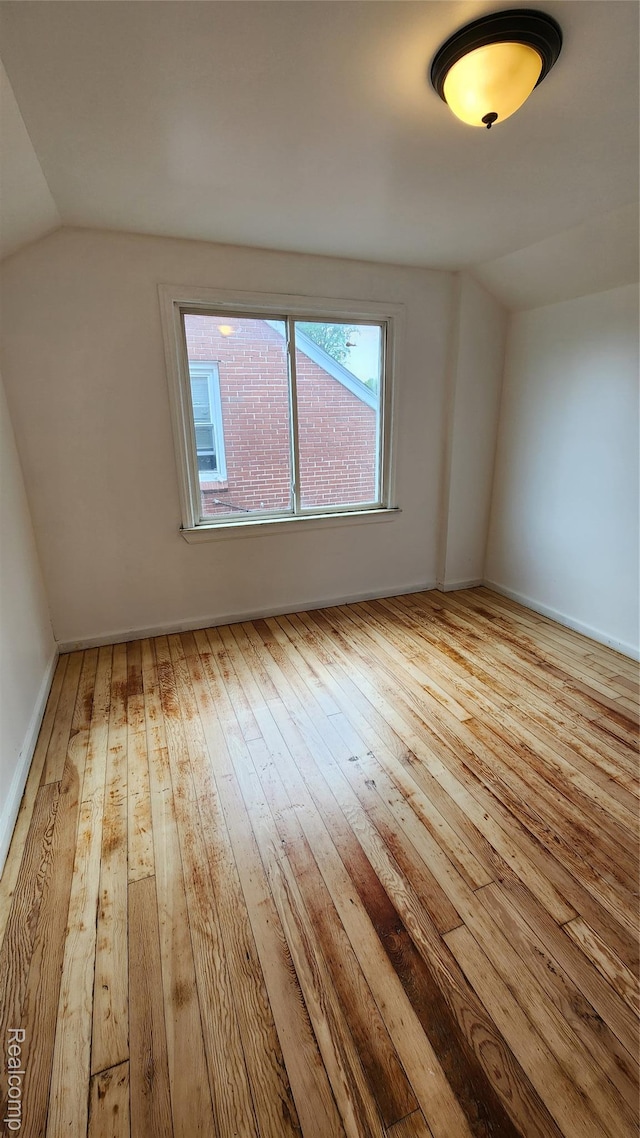 10947 Roxbury St, Detroit, MI 48224 - additional living space with hardwood / wood-style flooring and lofted ceiling