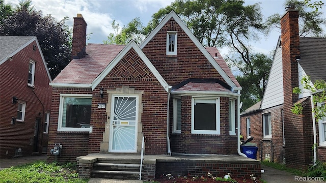 10947 Roxbury St, Detroit, MI 48224 - tudor house with brick siding and a chimney